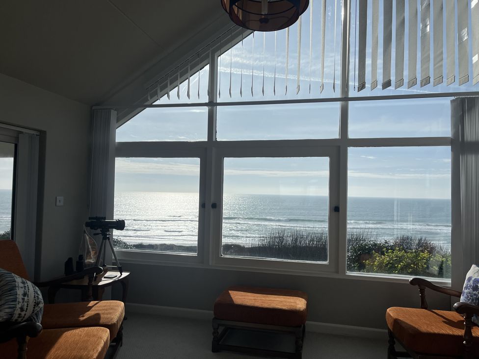 A living room with a view of the ocean at Stonecroft in Praa Sands
