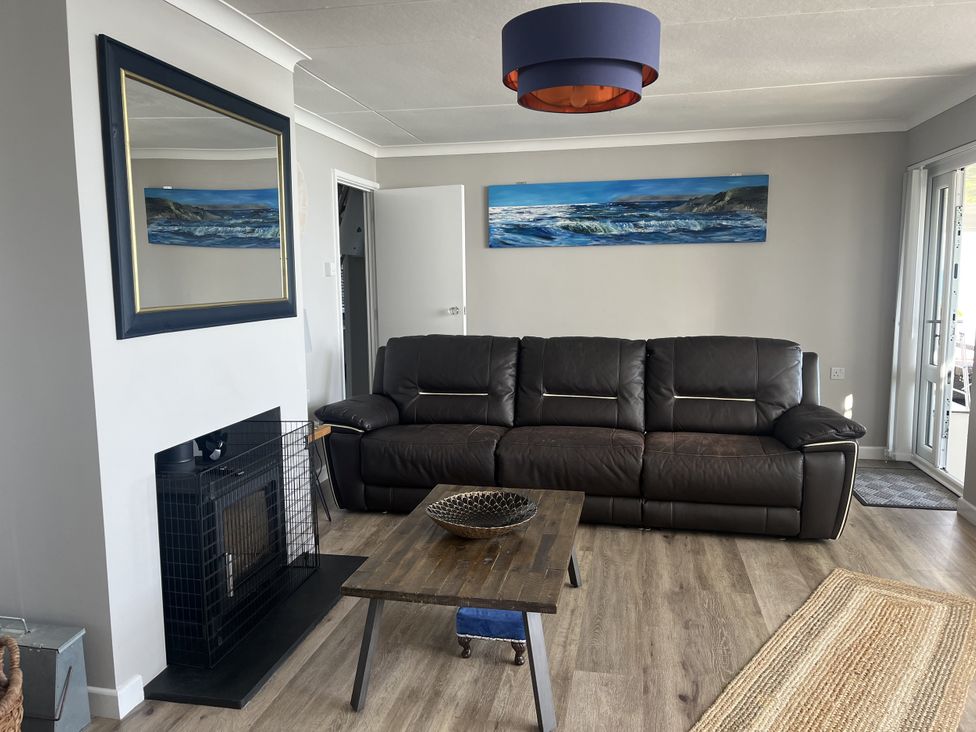 A living room with a sofa and coffee table at Stonecroft in Praa Sands
