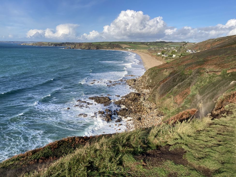 A coastal view with waves and rocks at Stonecroft in Praa Sands
