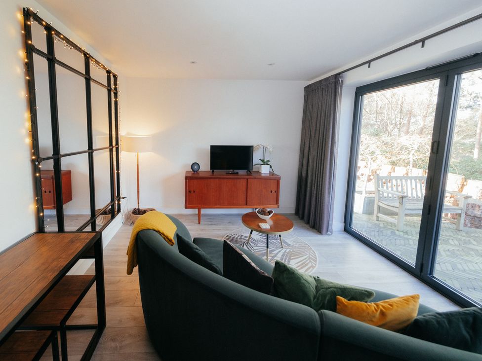 A living room with a sofa and coffee table at The Observatory Annexe Westcott near Dorking