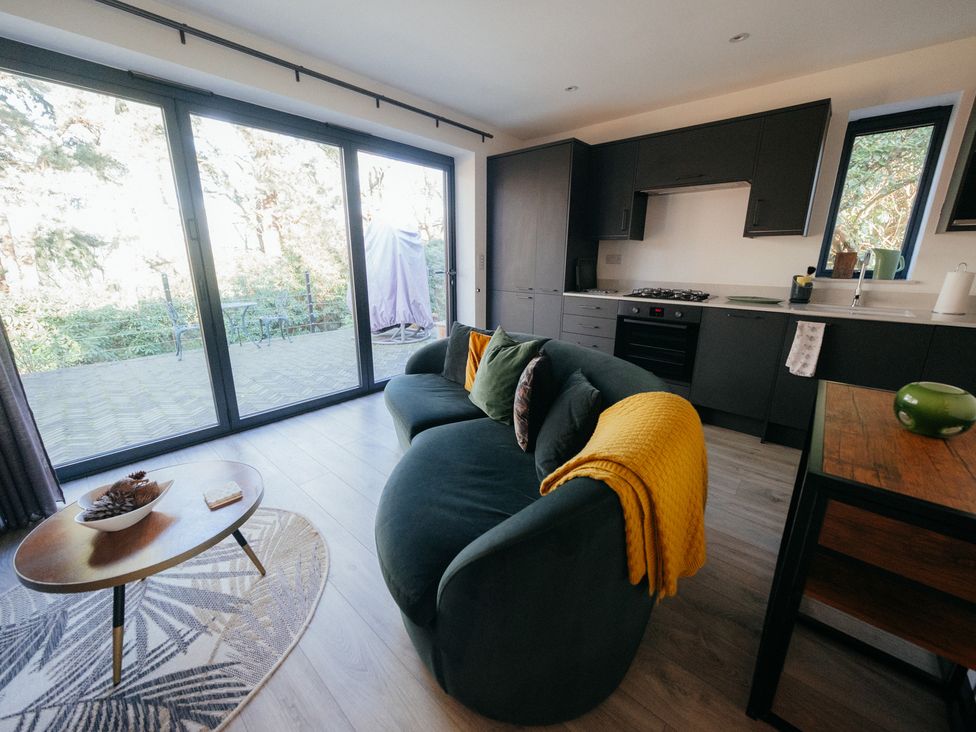 A living room with a sofa and coffee table at The Observatory Annexe Westcott near Dorking