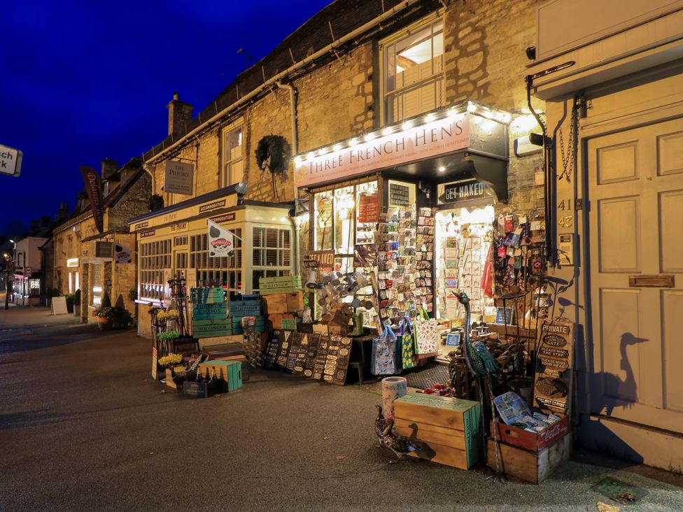 A storefront displaying various items at Three French Hens in Burford
