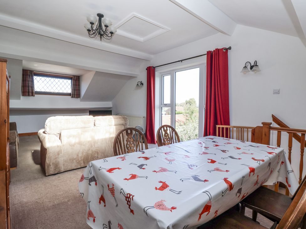 A dining room with a table and chairs at East Cottage in East Knapton near Rillington