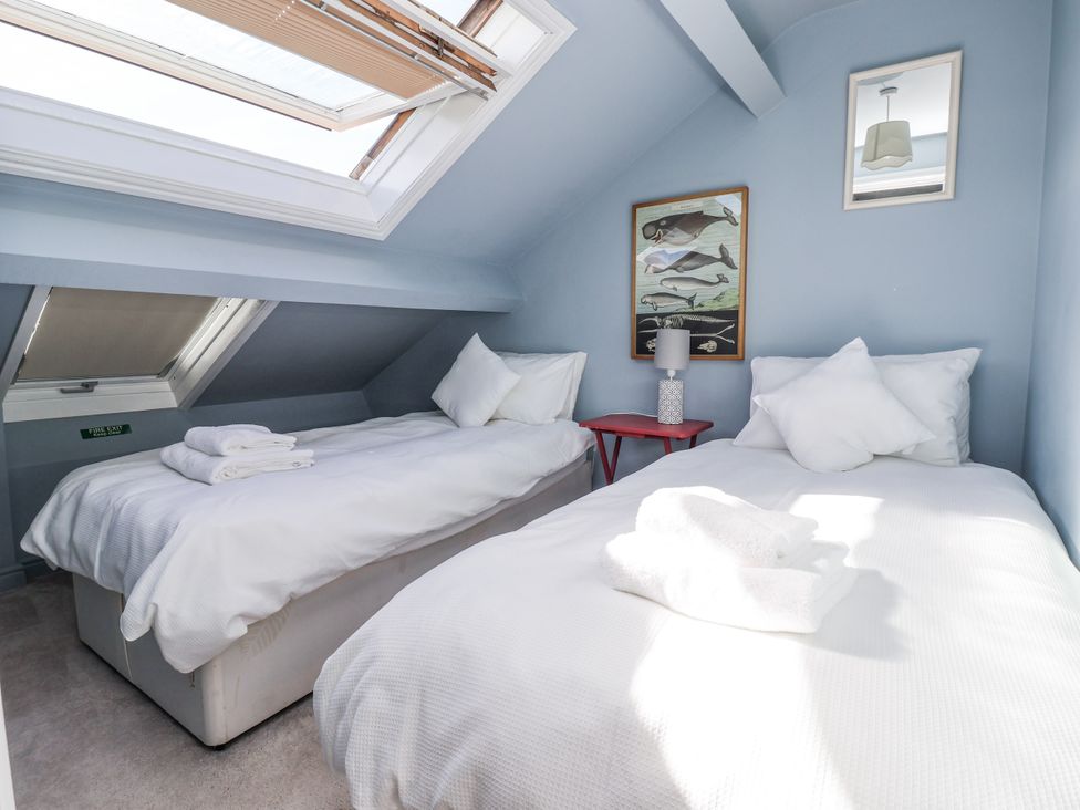 A bedroom with two beds and a window at East Cottage East Knapton near Rillington