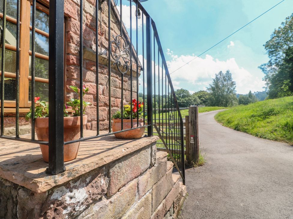 An entrance with flower pots and a path at Bluebell Barn Stoke-on-Trent