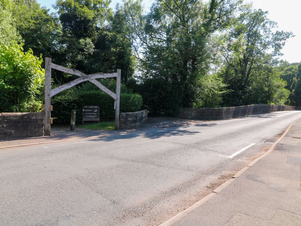 A wooden archway at a road in Bluebell Barn Stoke-on-Trent