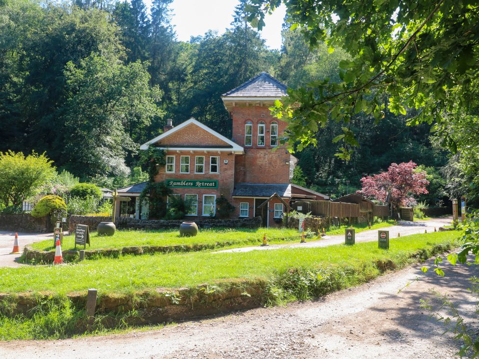 A building with signs and trees at Ramblers Retreat in Stoke-on-Trent