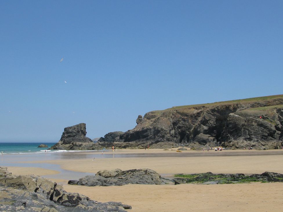 A beach with rock formations at Porthcothan House in Porthcothan