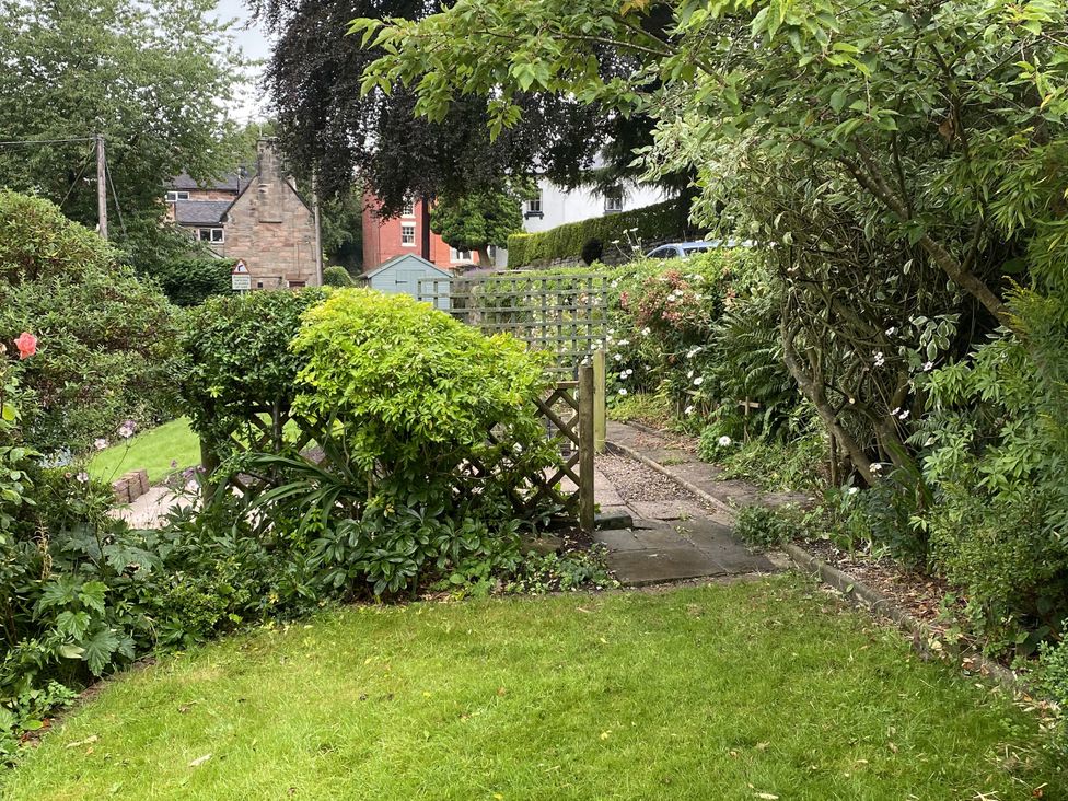 A garden with a pathway and plants at Yoxall Cottage Stoke-on-Trent