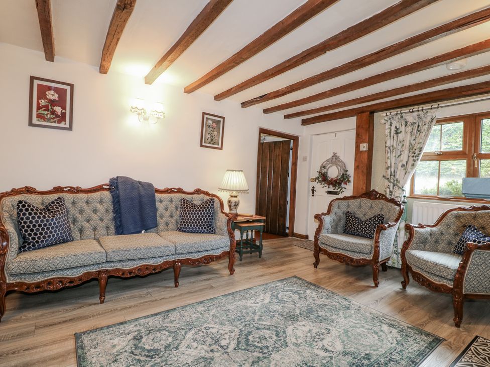 A living room with a sofa and armchairs at Yoxall Cottage Stoke-on-Trent