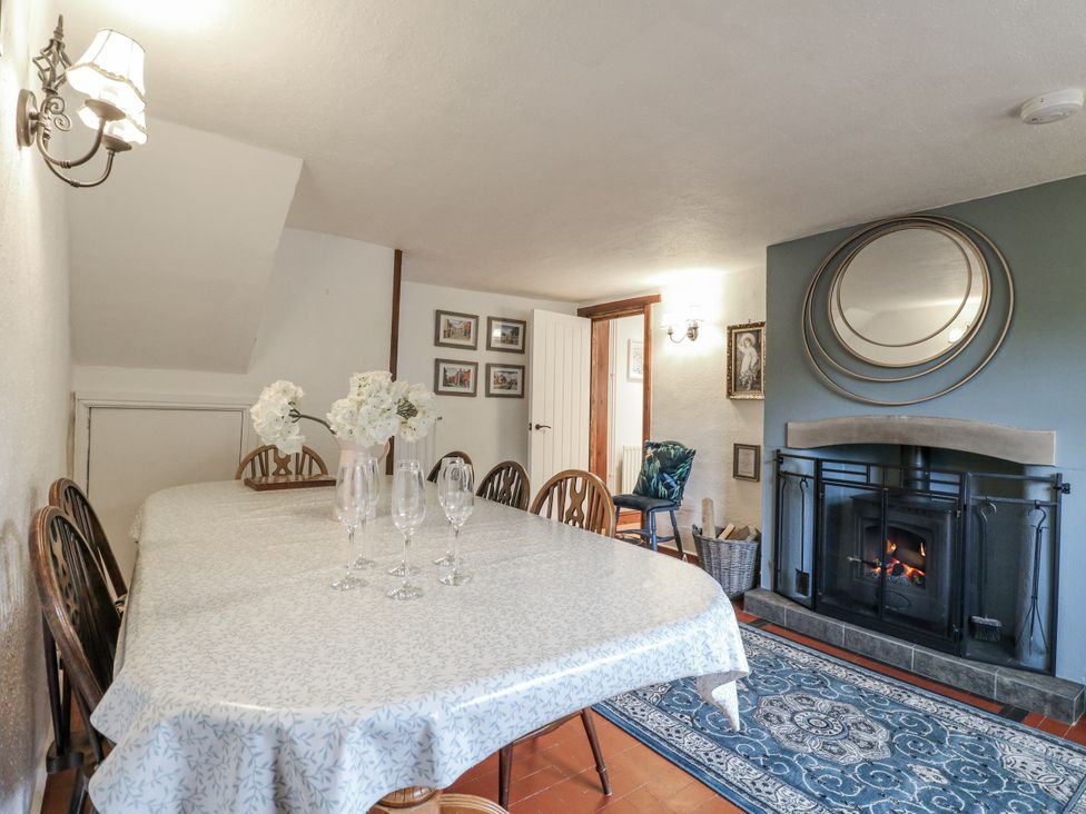 A dining room with a table and chairs at Yoxall Cottage Stoke-on-Trent