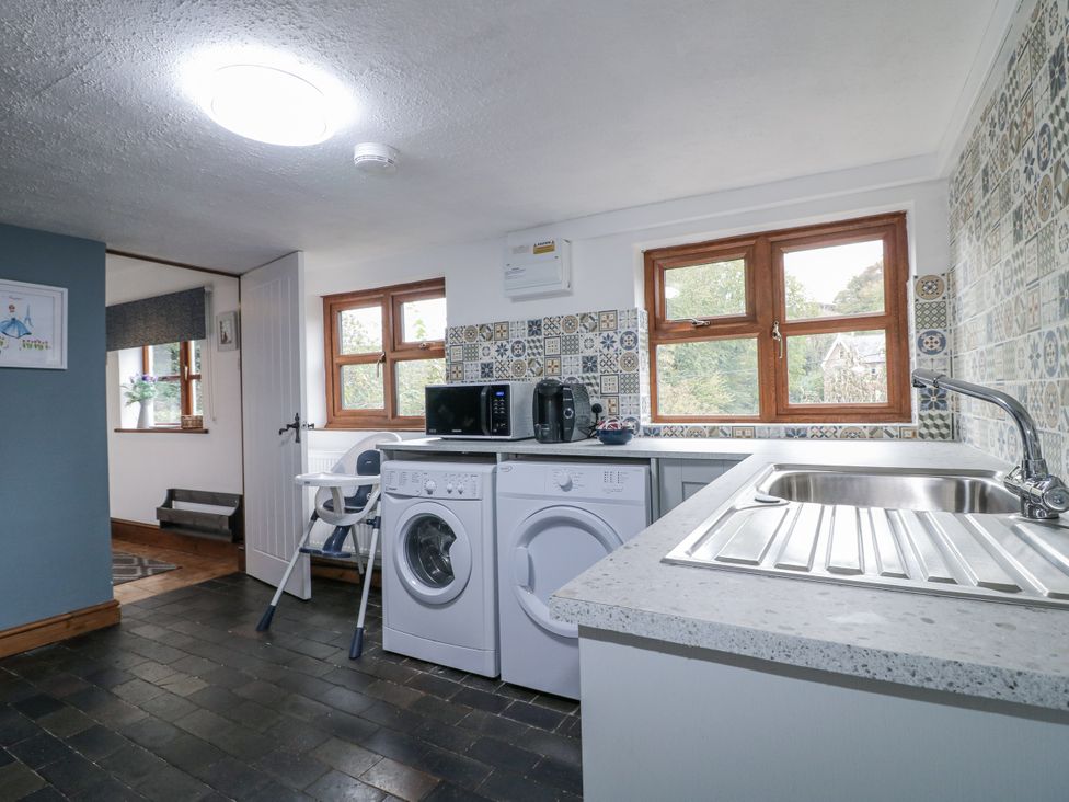 A kitchen with washing machine and dryer at Yoxall Cottage in Stoke-on-Trent