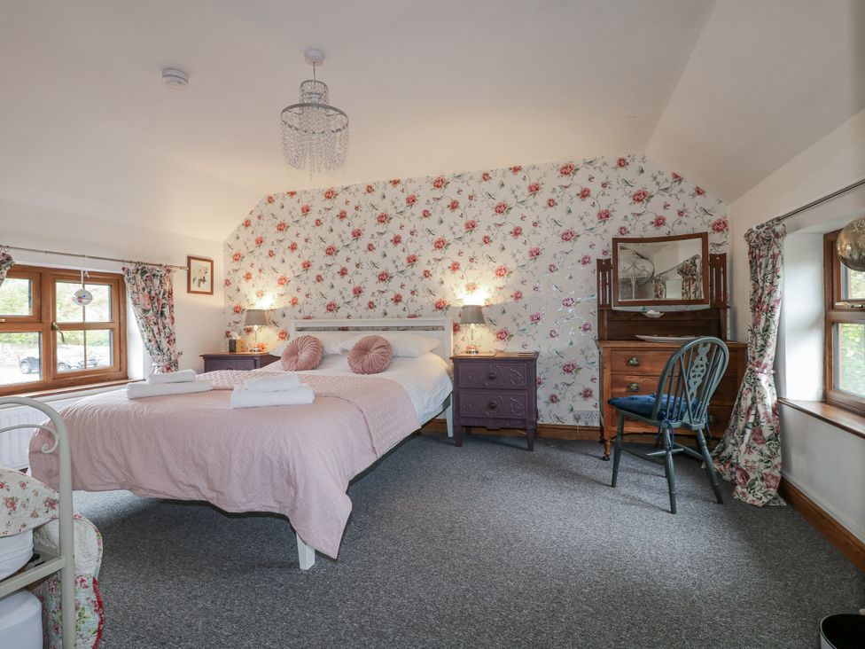 A bedroom with a bed and furniture at Yoxall Cottage Stoke-on-Trent