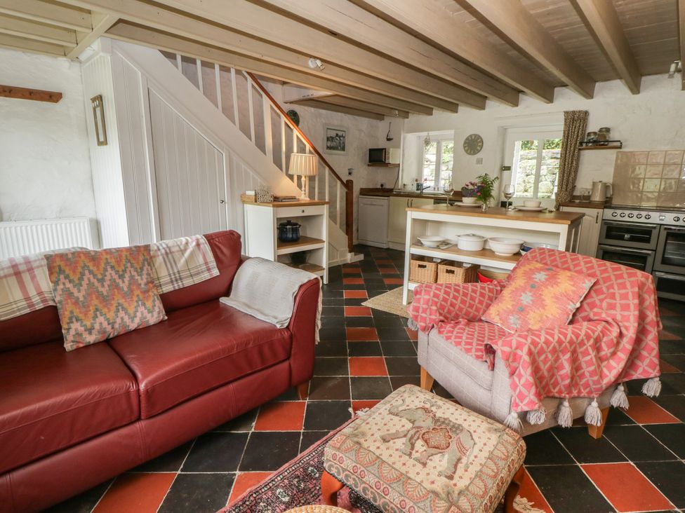 A living room with a sofa and armchair at Sycamore Vestry Pontfaen near Fishguard