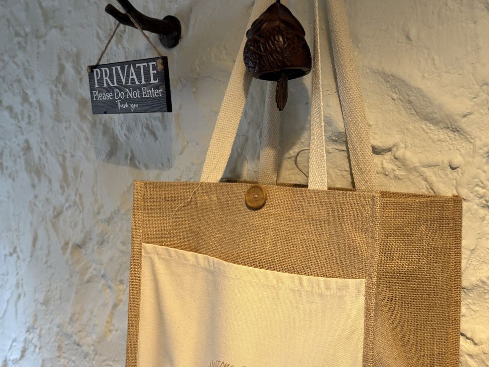 A bag hanging on a wall with a private sign at The Captain's Nest in Bunbeg, County Donegal