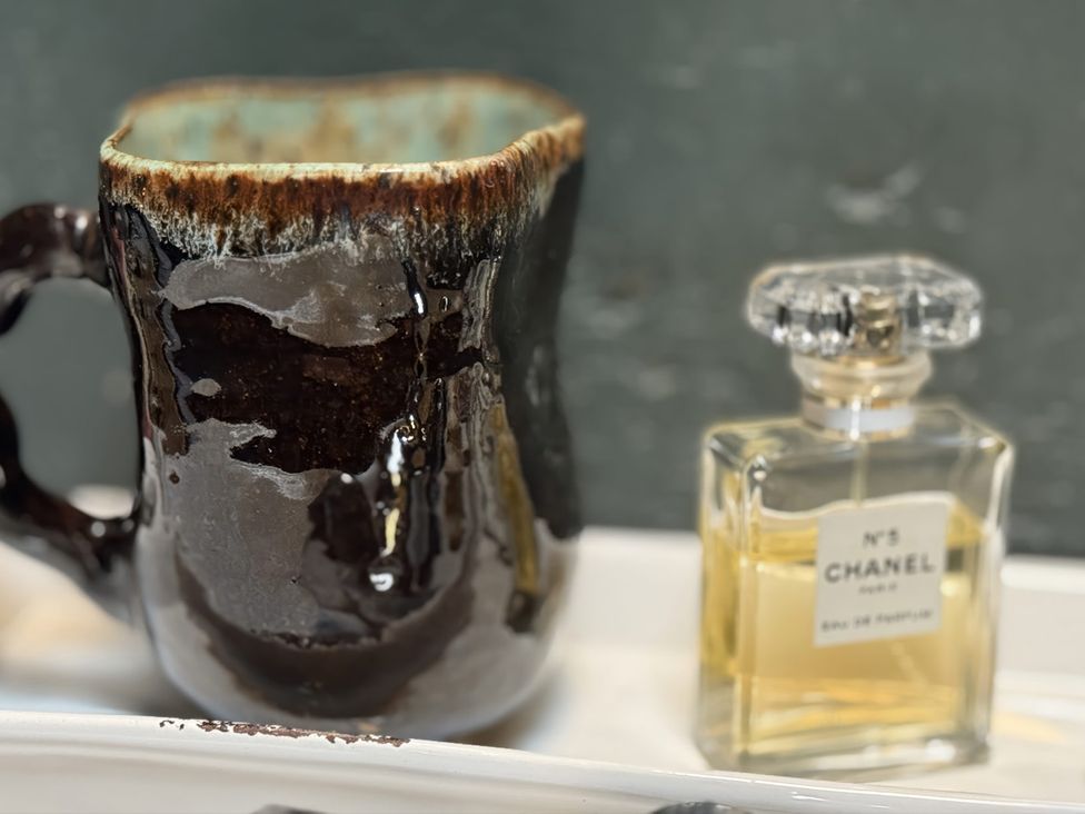 A mug and a Chanel perfume bottle at The Captain's Nest in Bunbeg, County Donegal