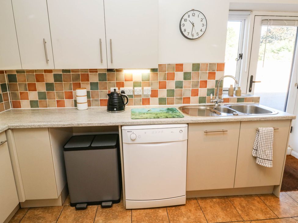 A kitchen with appliances and fittings at 3 Town Farm Court in Newton Abbot