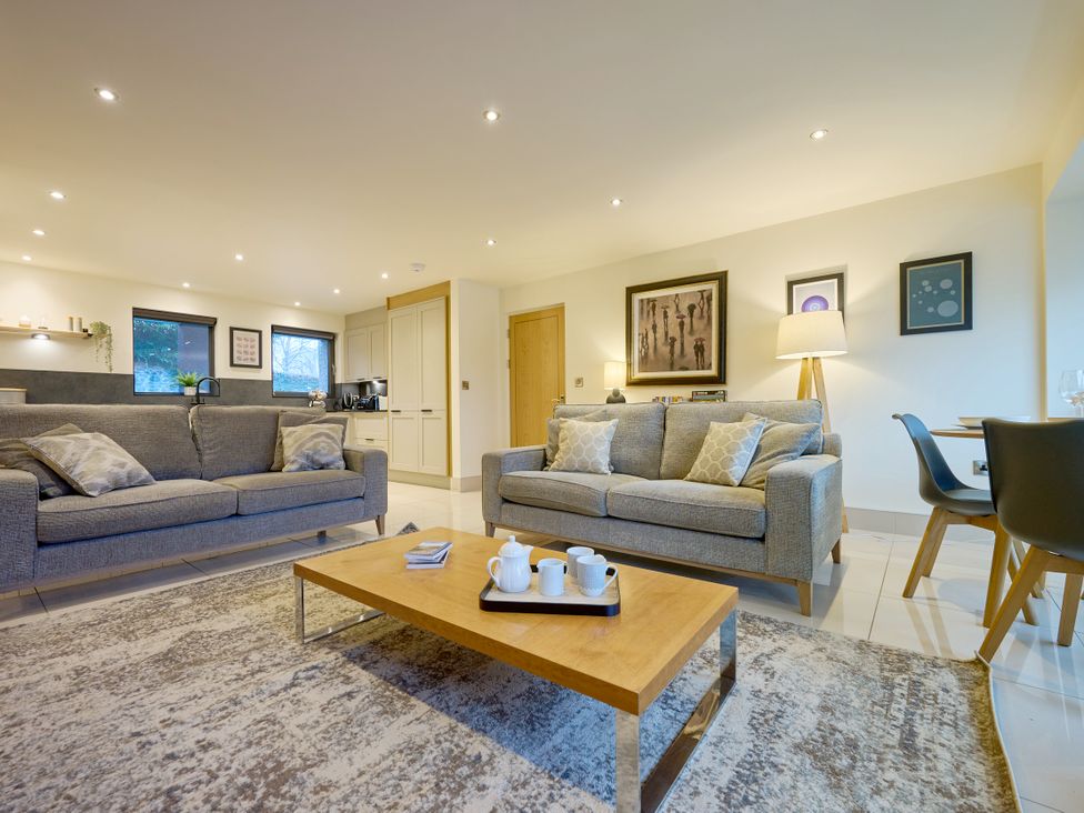A living room with sofas and a coffee table at Riverside Park 1 in Keswick