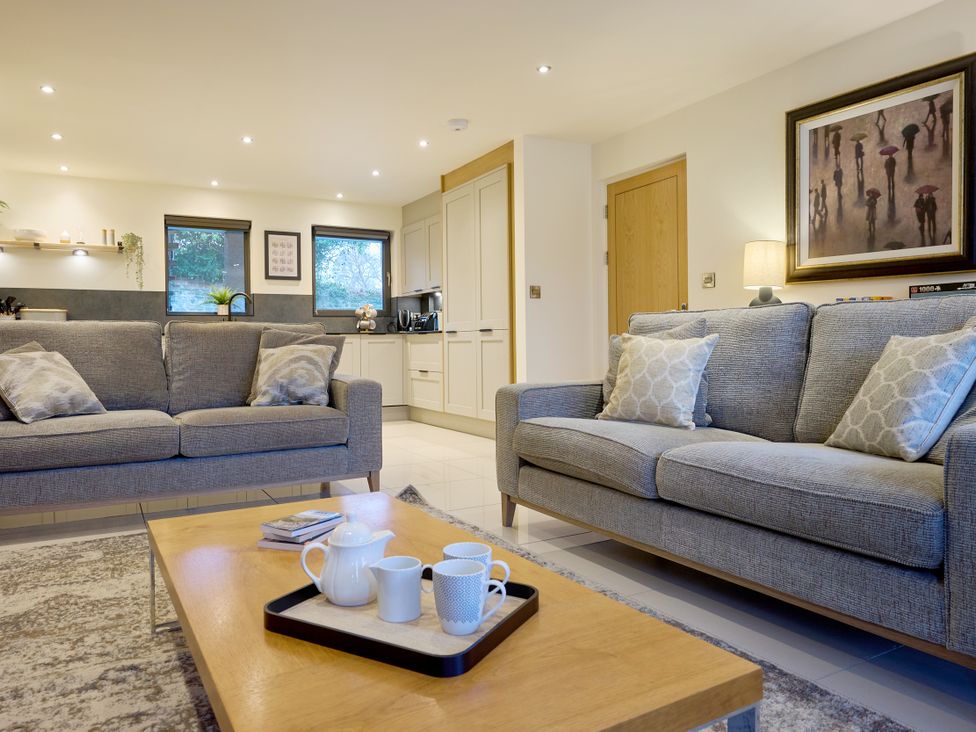 A living room with a sofa and coffee table at Riverside Park 1 in Keswick