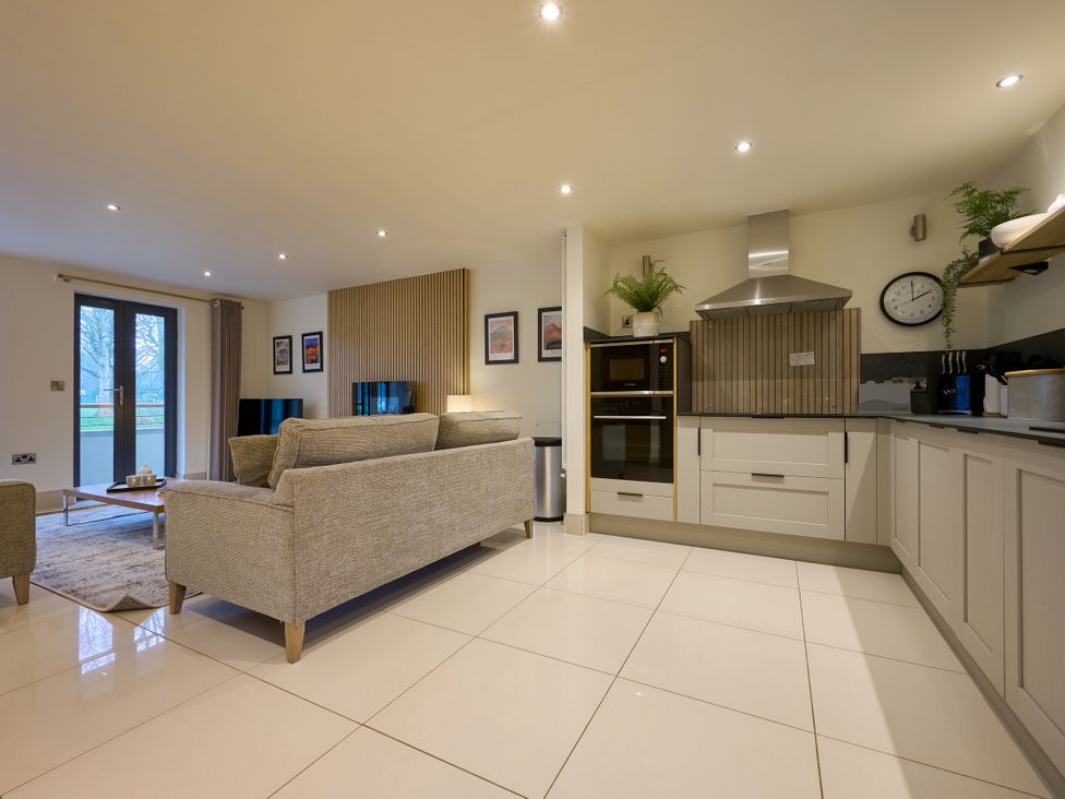 A living room with a sofa and coffee table at Riverside Park 1 in Keswick