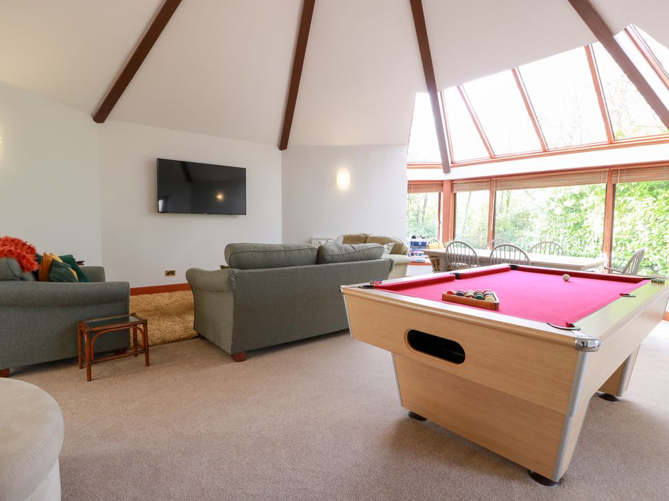 A snug with a pool table and sofas at Shieldhill Farm House in Falkirk