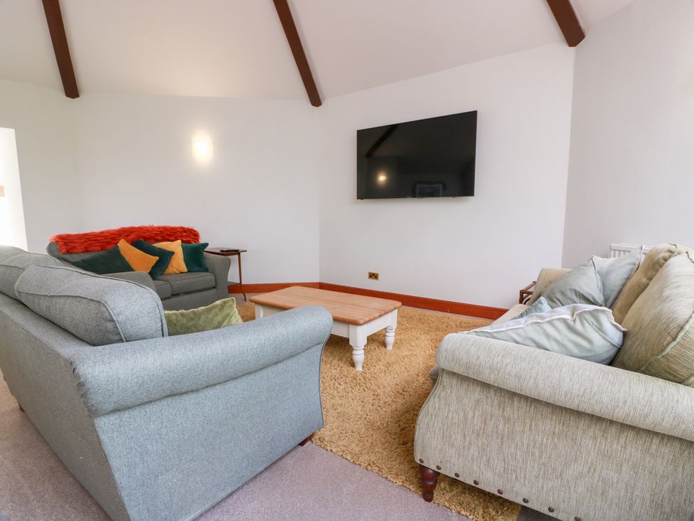 A living room with sofas and a coffee table at Shieldhill Farm House in Falkirk