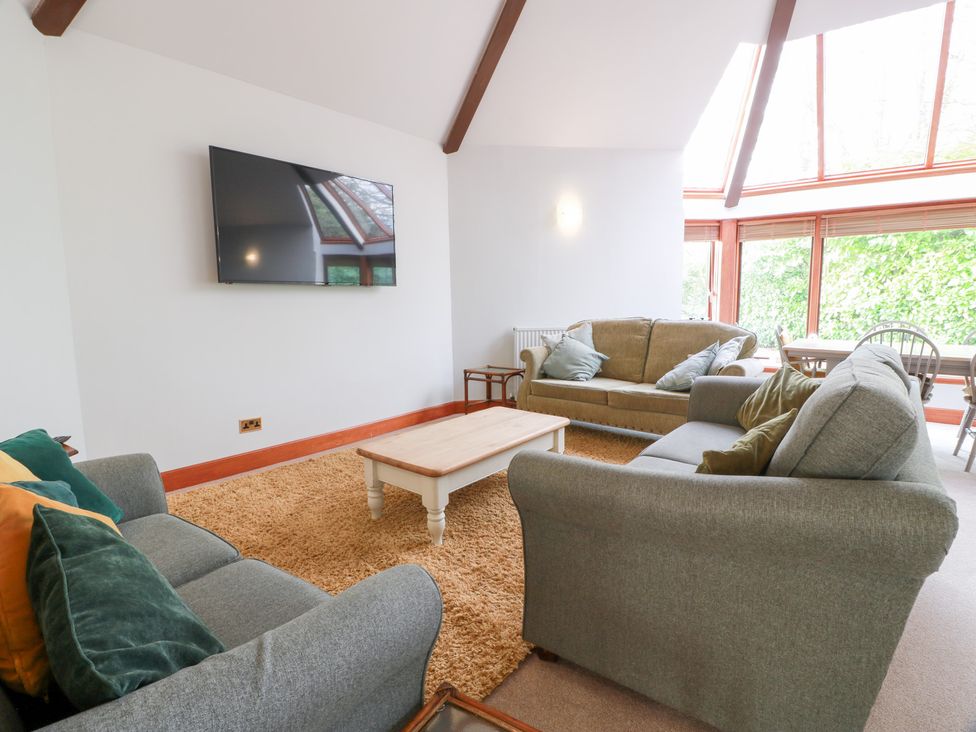 A living room with sofa and television at Shieldhill Farm House in Falkirk