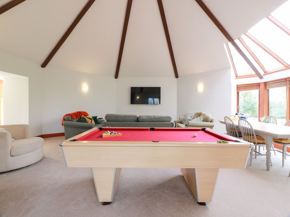 A recreation room with a pool table and seating area at Shieldhill Farm House in Falkirk