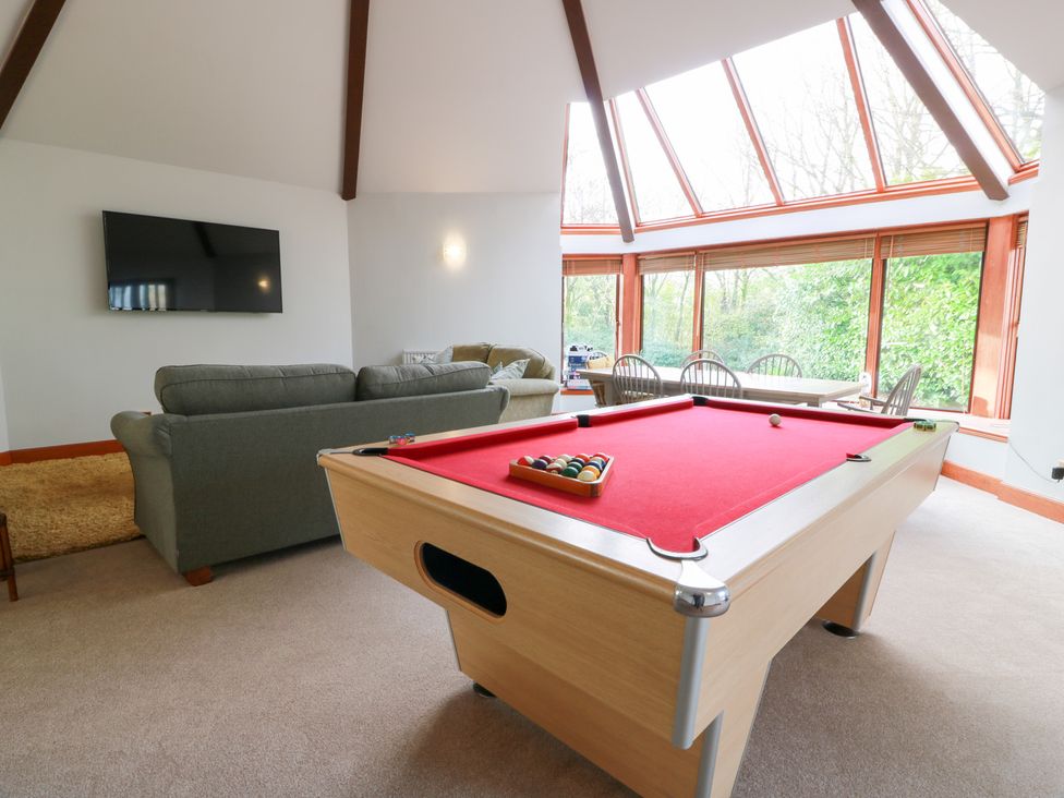 A game room with a pool table and sofa at Shieldhill Farm House in Falkirk