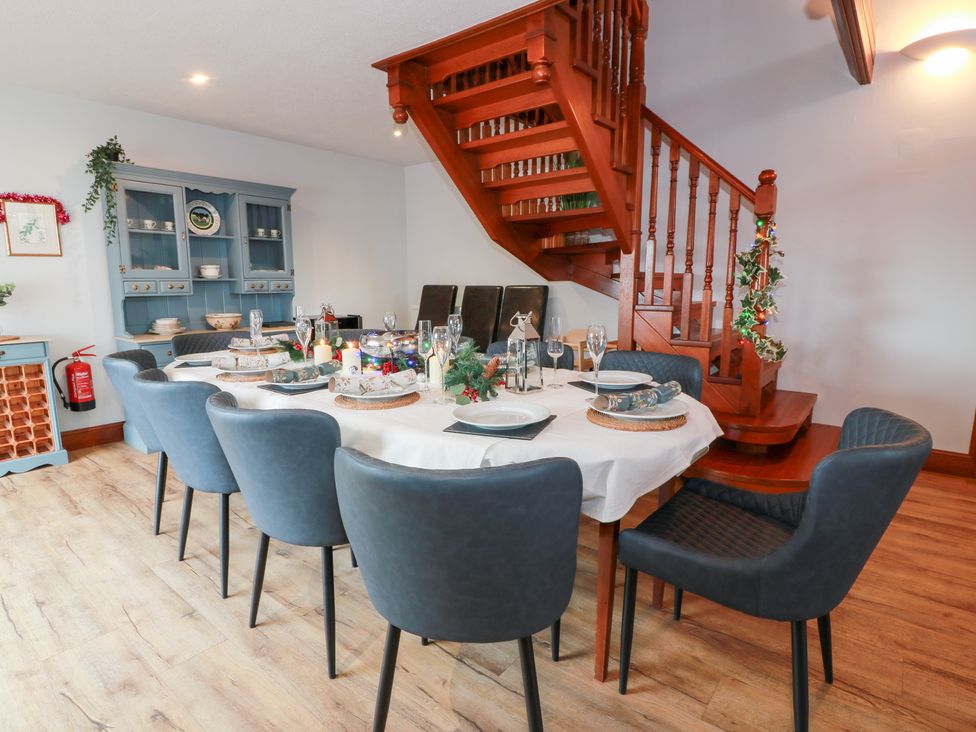 A dining room with a large table and chairs at Shieldhill Farm House in Falkirk