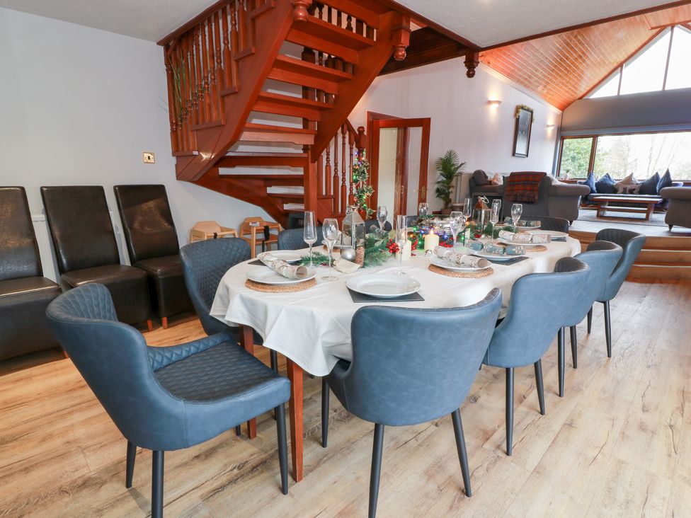 A dining room with a table set for dinner at Shieldhill Farm House in Falkirk