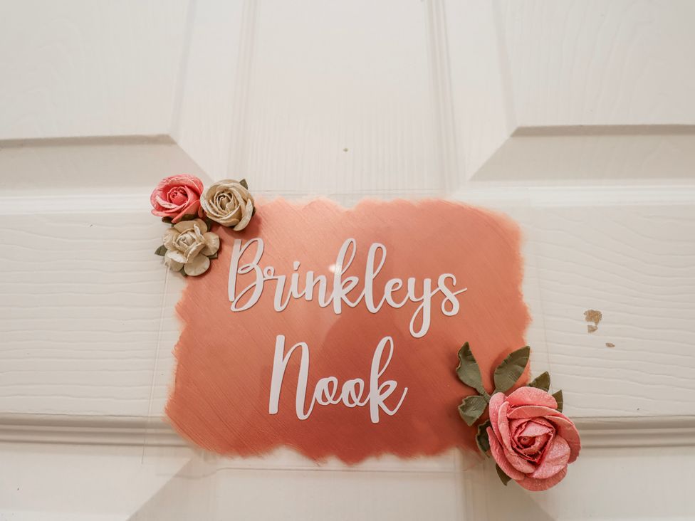A nameplate on a door reading Brinkleys Nook