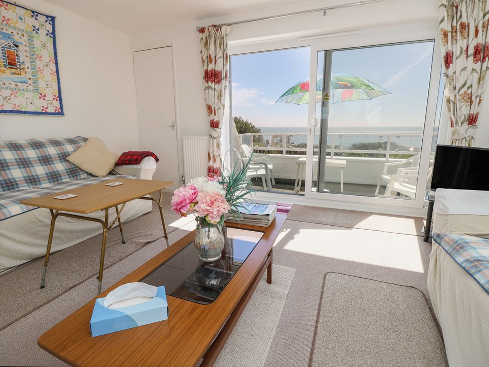 A living room with a sofa and coffee table at Bella vista in Selsey, West Sussex
