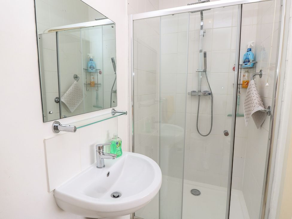 A bathroom with a sink and shower at Bella vista in Selsey, West Sussex