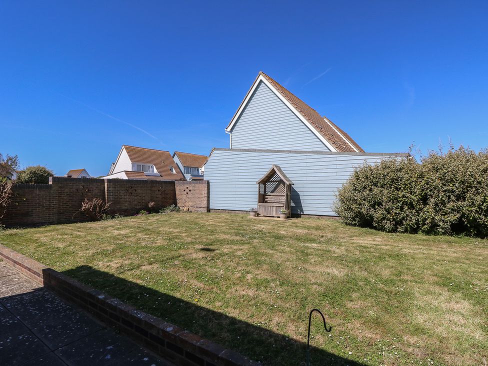 A garden with a wooden structure at Bella vista Selsey, West Sussex
