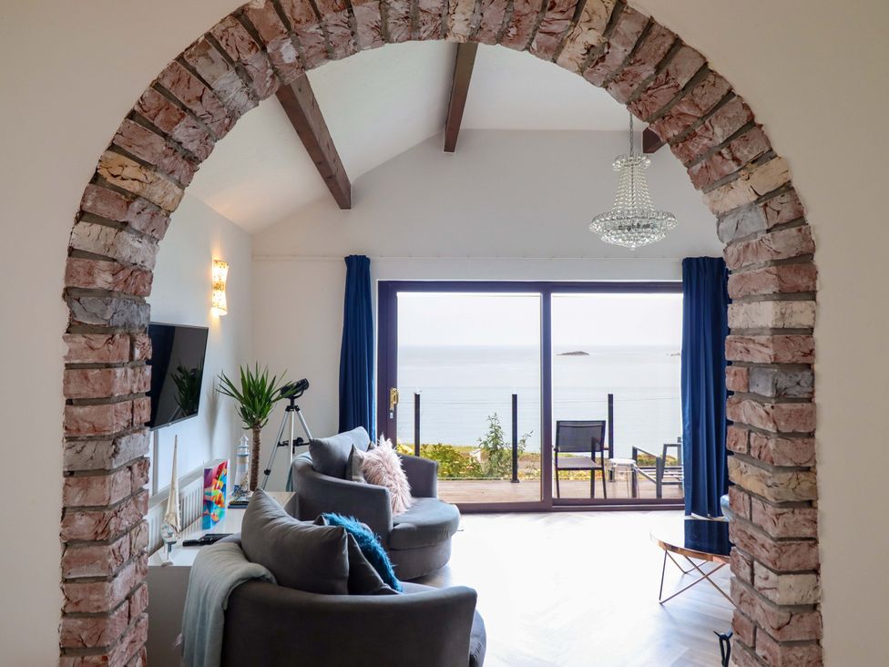 A living room with a view of the sea at Ser a Mor (Stars and Sea) Bull Bay near Amlwch