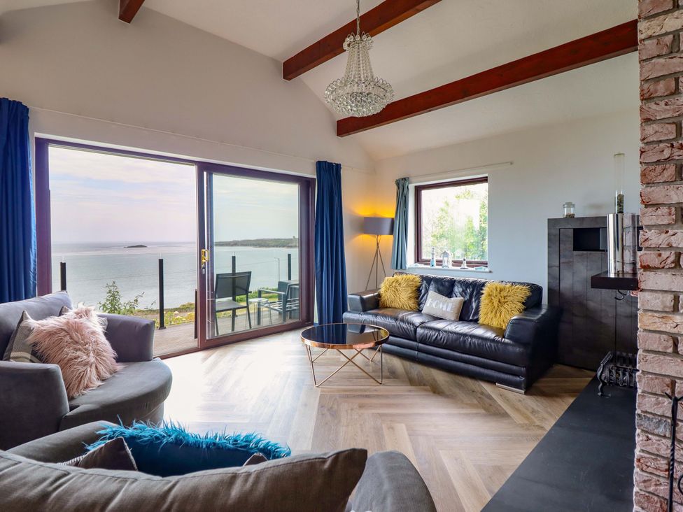 A living room with a view of the sea at Ser a Mor (Stars and Sea) Bull Bay near Amlwch