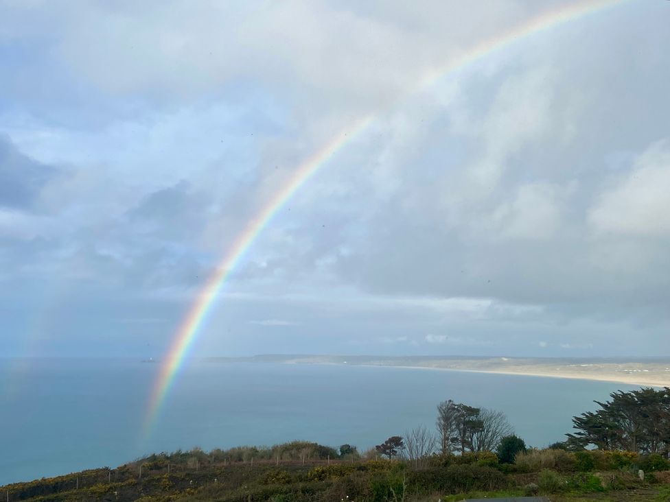 A rainbow over the ocean at 5 St Gwithian Apartments in Carbis Bay