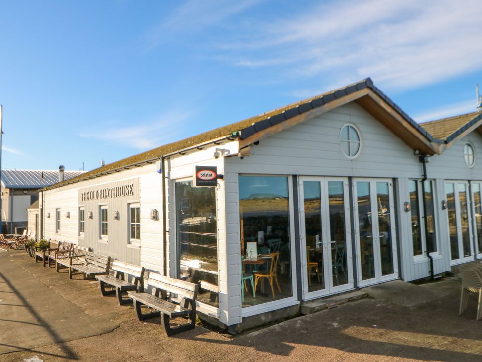 An outdoor view of a seaside building at The Old Boathouse in Amble