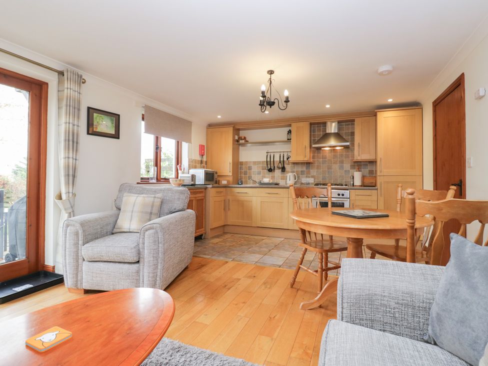 A kitchen with a dining area at Low Dow Crag in Coniston