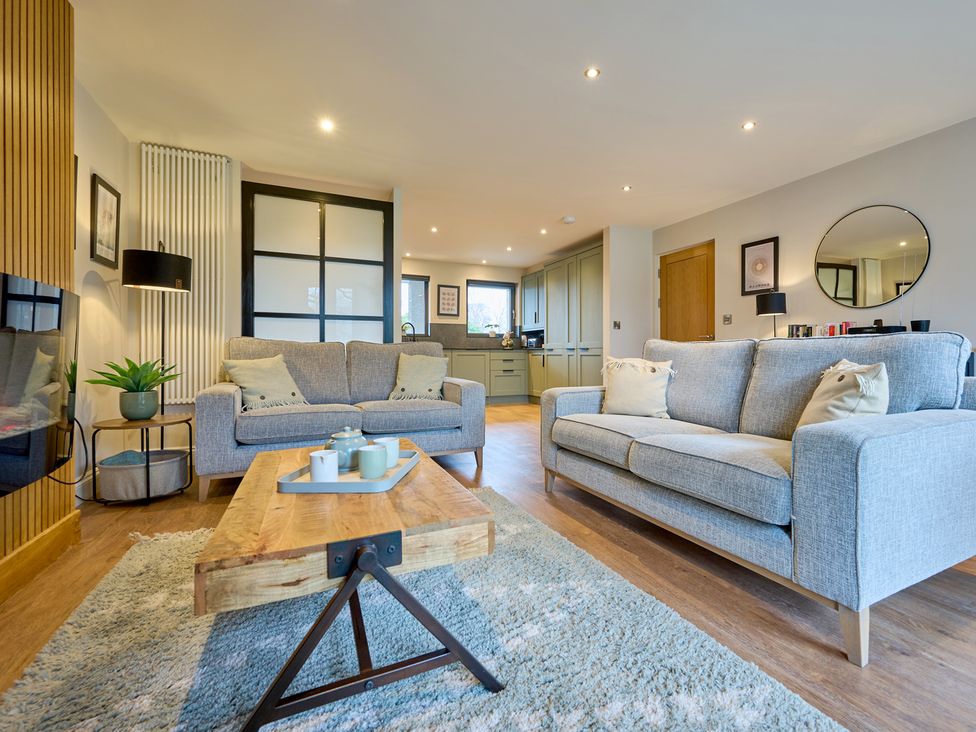 A living room with sofas and a coffee table at Riverside Park 3 in Keswick
