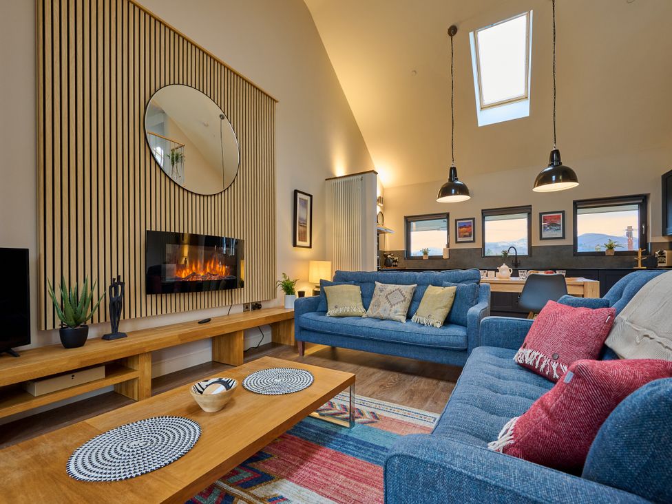 A living room with a sofa and coffee table at Riverside Park 5 in Keswick