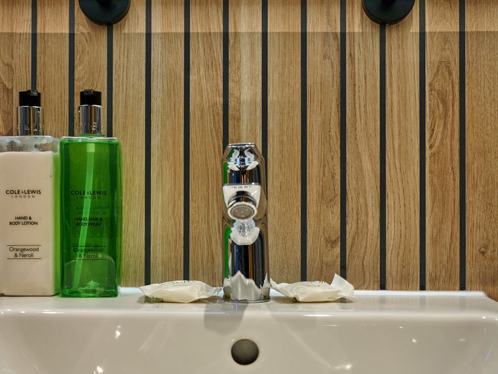 A sink with toiletries at Riverside Park 5 in Keswick