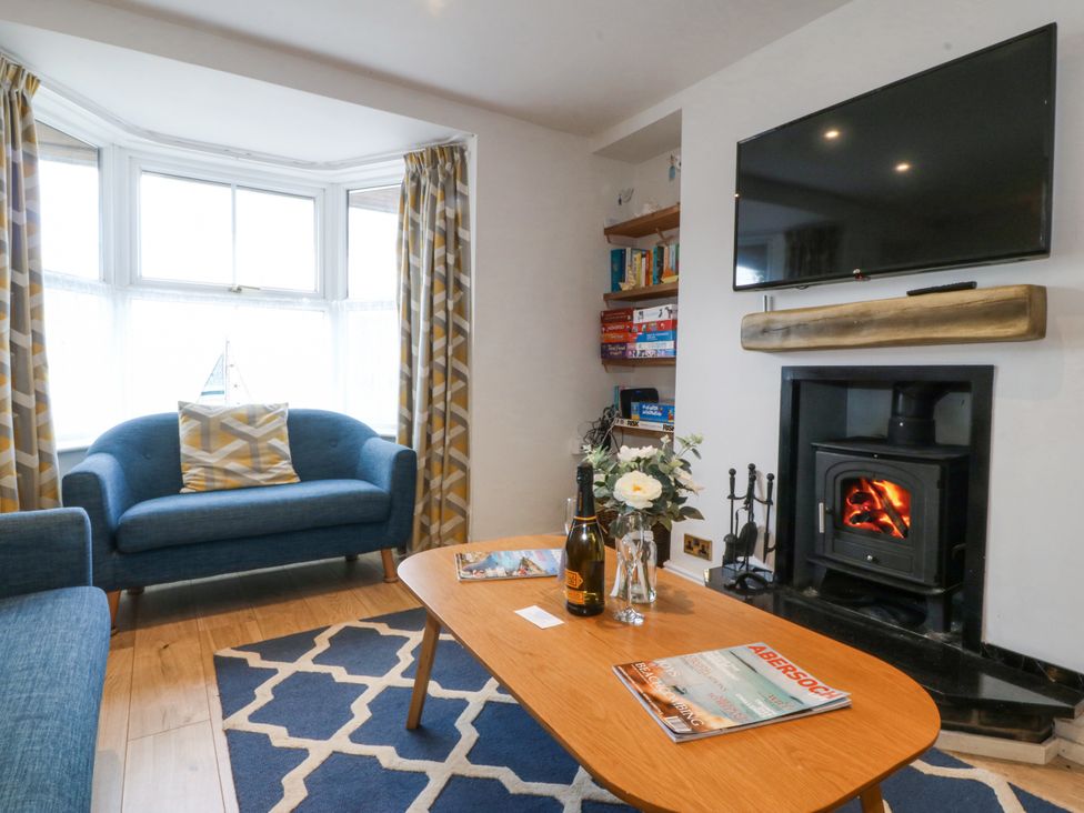 A living room with a sofa and coffee table at Bryn Awel in Mynytho near Abersoch