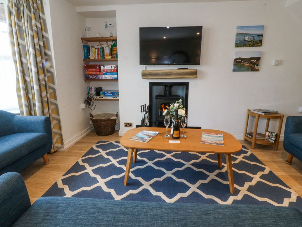A living room with a sofa and a coffee table at Bryn Awel in Mynytho near Abersoch