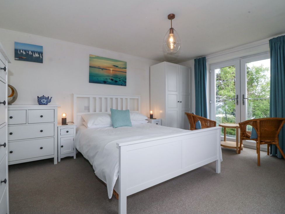 A bedroom with a bed and drawer at Bryn Awel in Mynytho near Abersoch