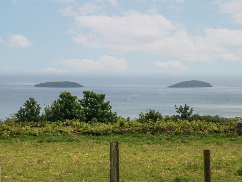 A view of two islands across the sea at Bryn Awel in Mynytho near Abersoch