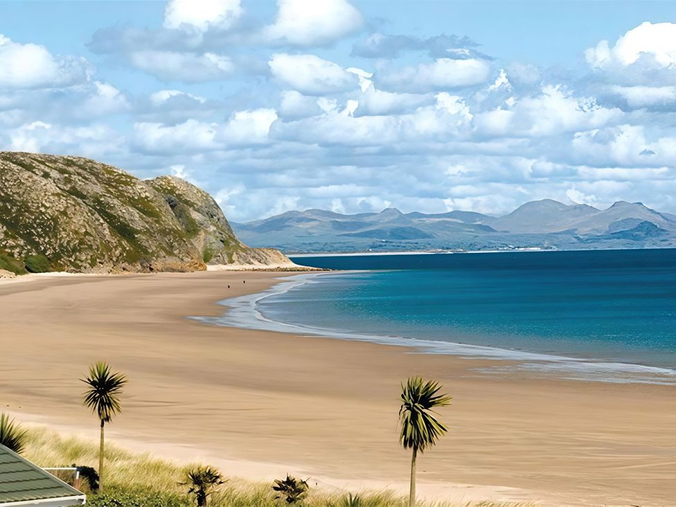 A beach with mountains in the background at The Warren D7 Abersoch