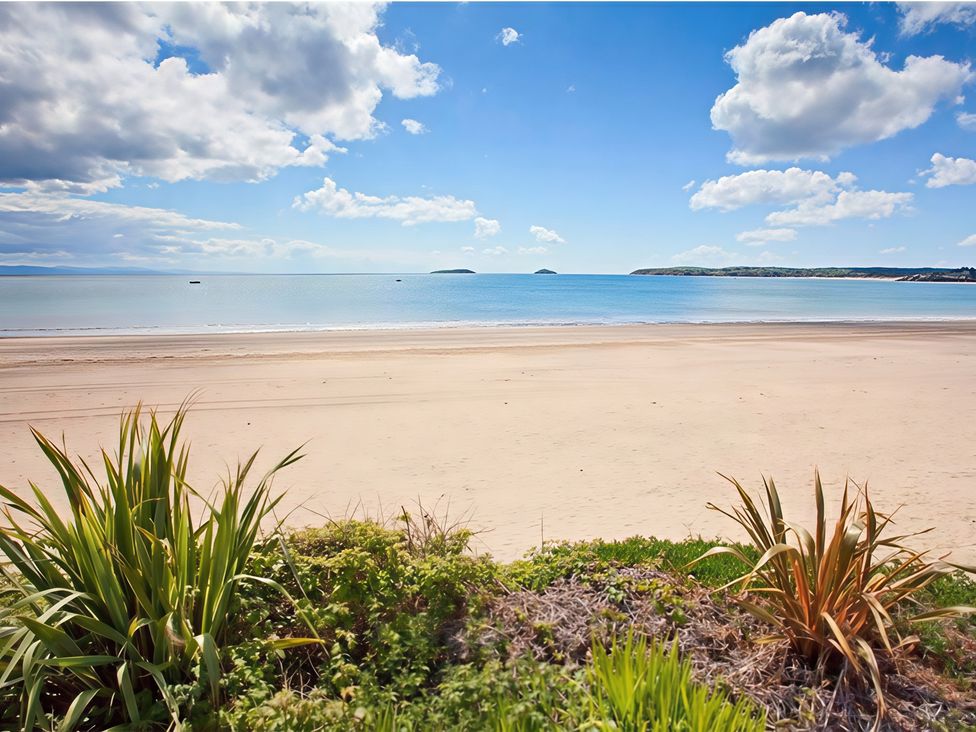 A beach with sea and cloudy sky at The Warren D7 in Abersoch