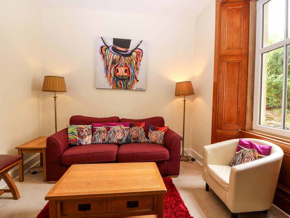 A living room with a sofa and coffee table at Tayview in Killin